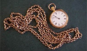 A Ladies 18ct gold pocket watch and 9ct gold chain
