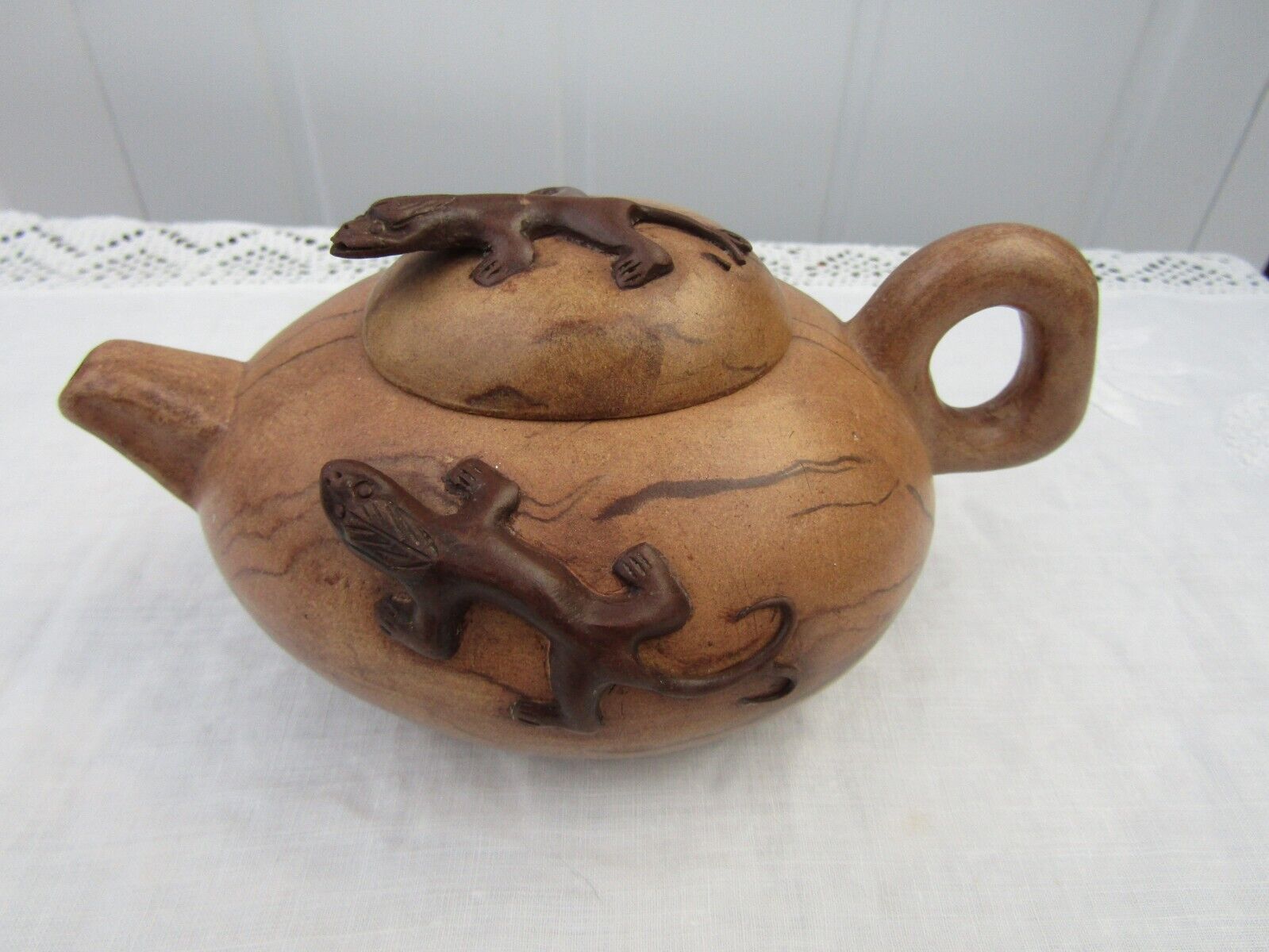 antique Chinese terracotta tea pot with lizard detail, stamped.