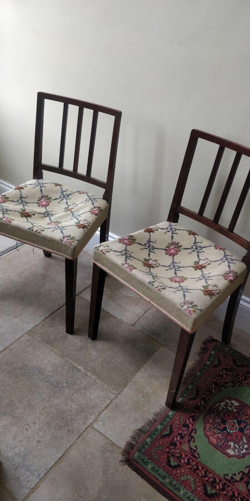 A pair of Antique Brown Wooden Dining Chairs with Tapestry Seats in need of TLC