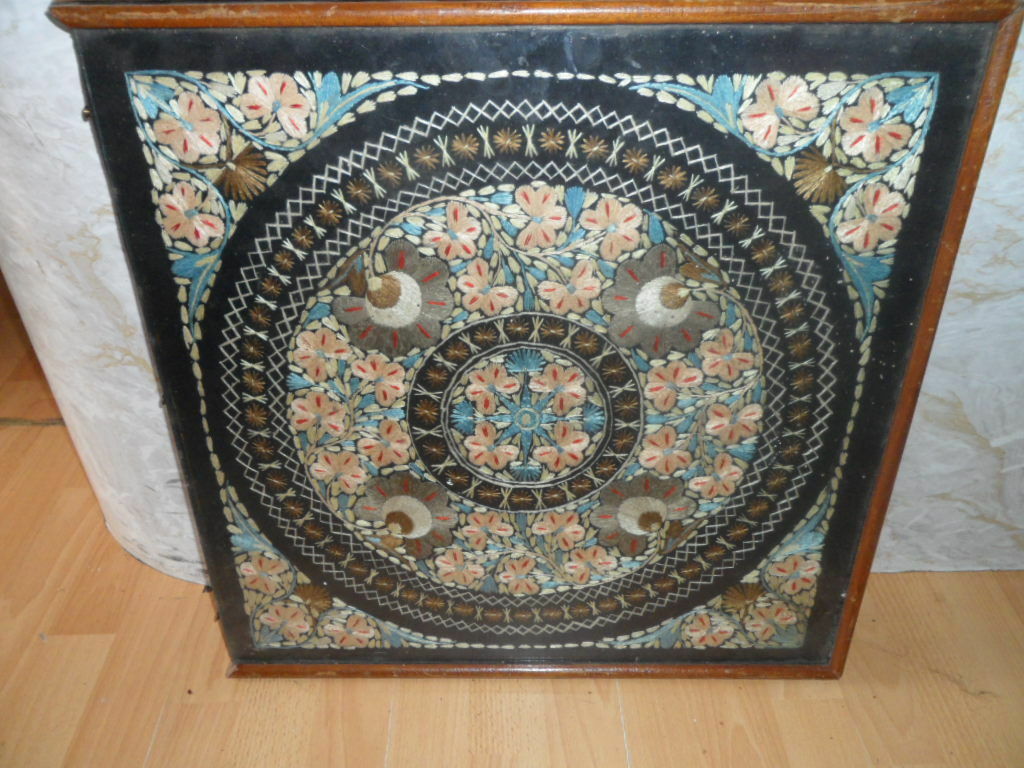 old victorian tapestry in a wood frame and glass top