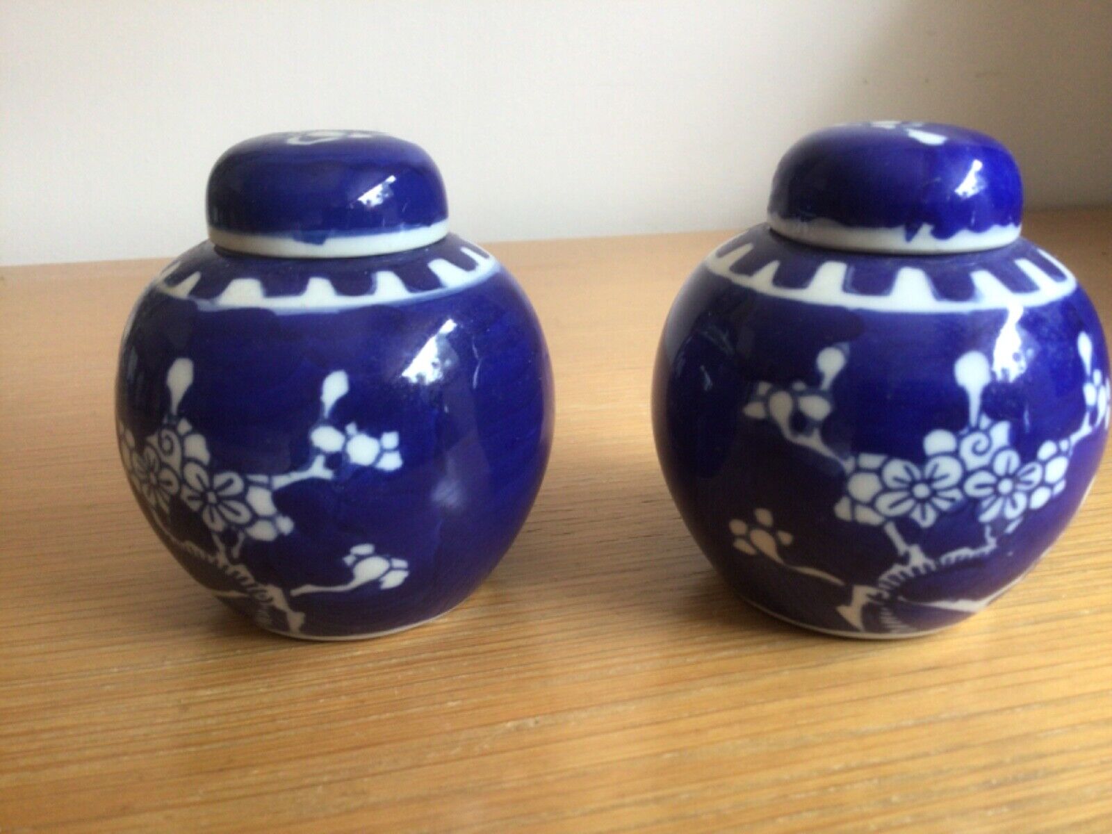 Antique Valuations: Pair of Blue & White Chinese Ginger Jars with Lids Prunus Pattern
