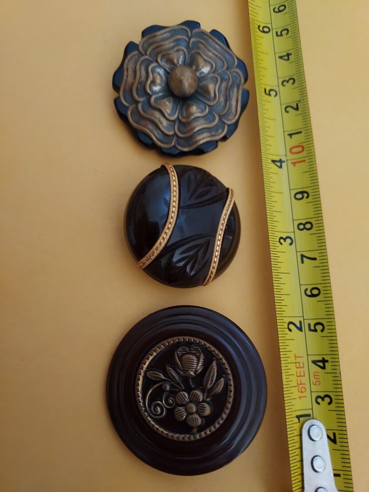 Antique Valuations: 3 Old Plastic Buttons With Metal Ornamentation