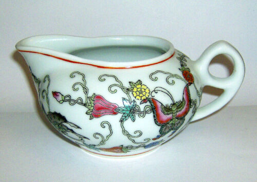 Antique Valuations: Chinese MILK JUG / CREAMER floral and butterfly pattern on a white background