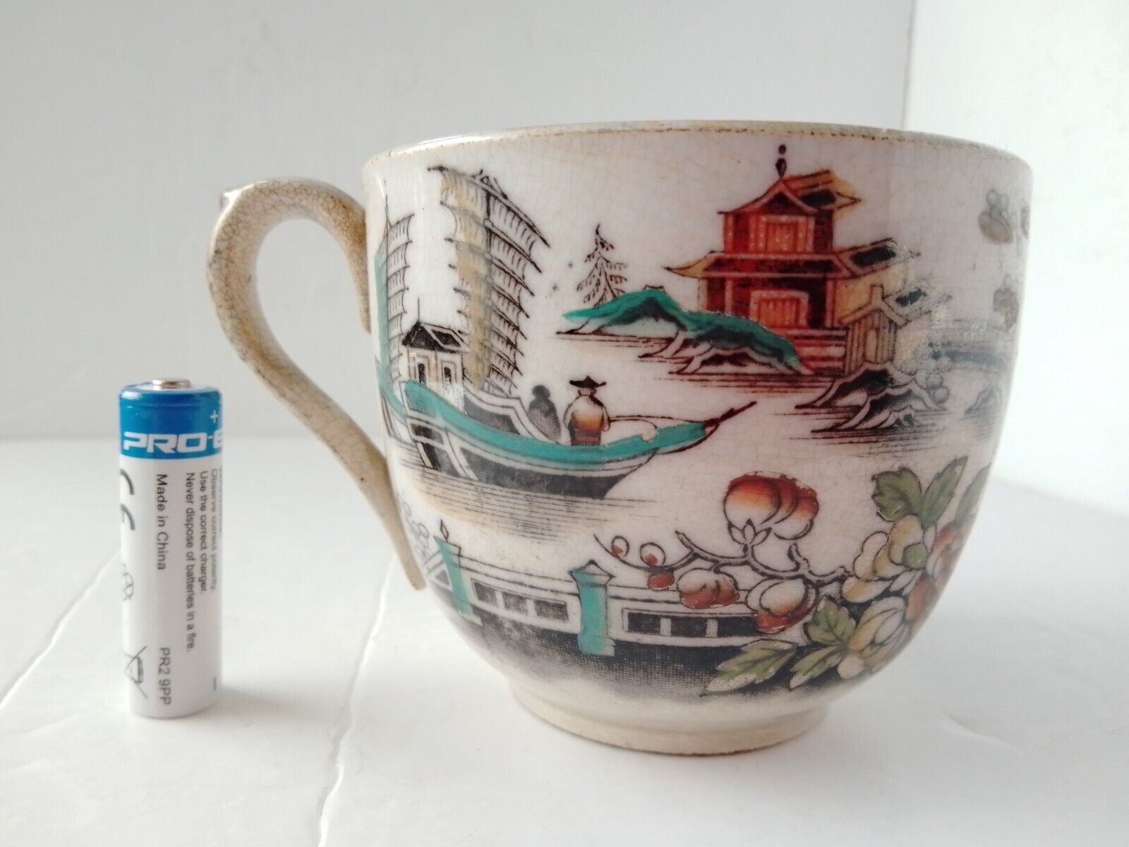 Antique Valuations: 19c English Chinoiserie Large Teacup Stoneware Transfer Print