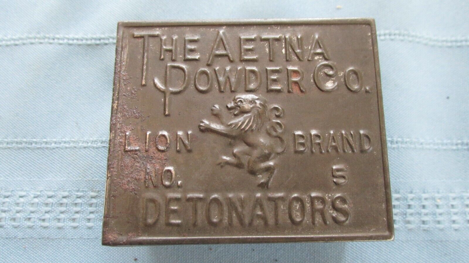 Antique Valuations: Embossed Aetna Powder Company No. 5 Lion Brand Detonators-Blasting Caps Tin
