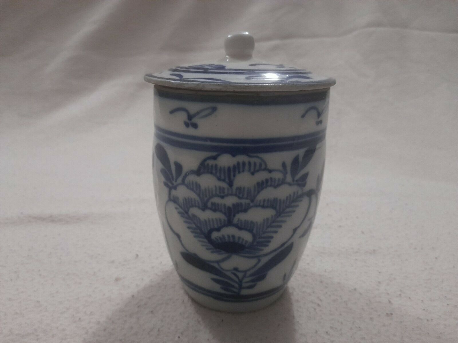Antique Valuations: Blue And White Hand Painted Stoneware Jar With A Lid. Chinese In Origin