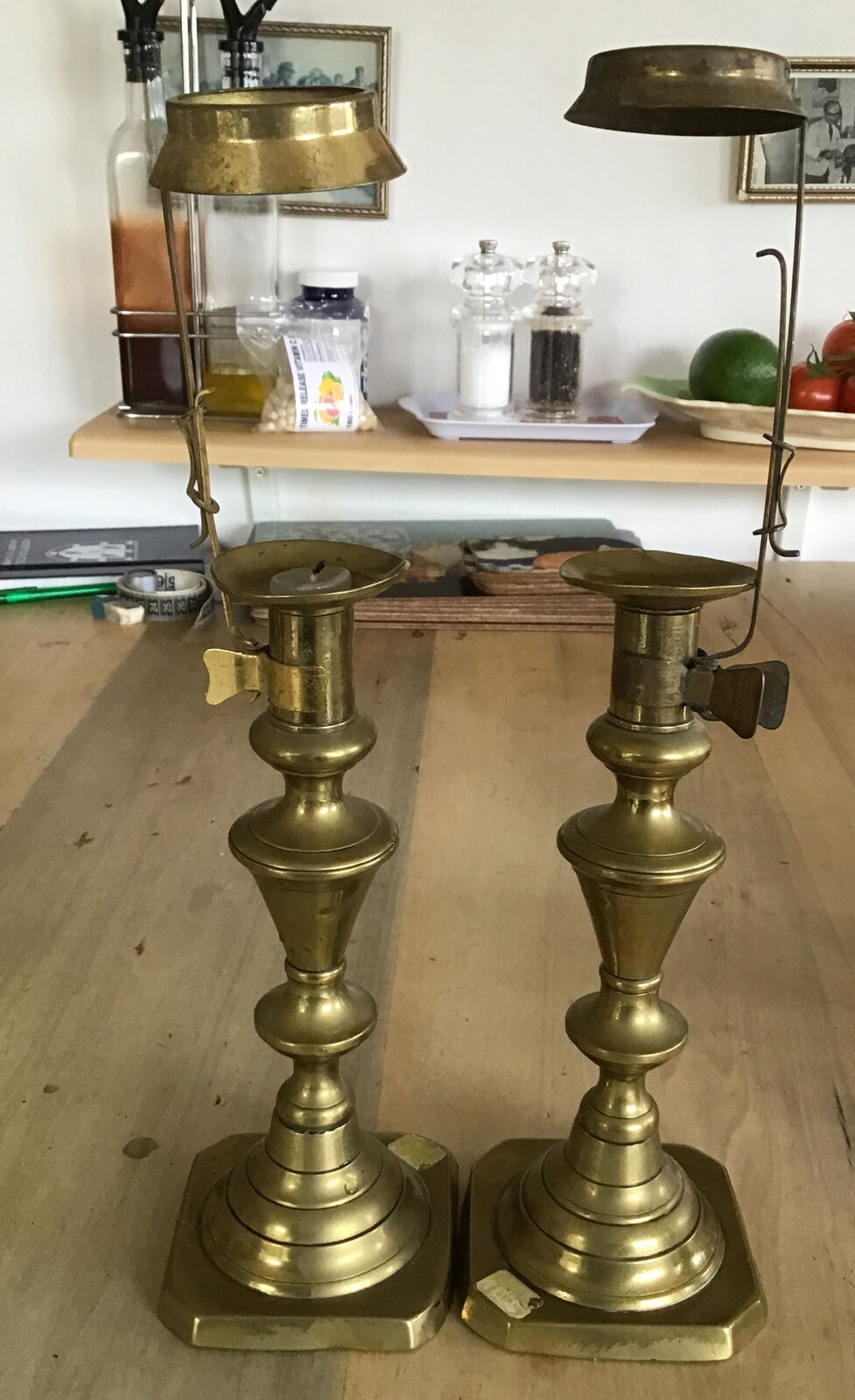 Antique Valuations: Pair Of Victorian Brass Candlesticks Tapering Stems With Attached Shade Holders