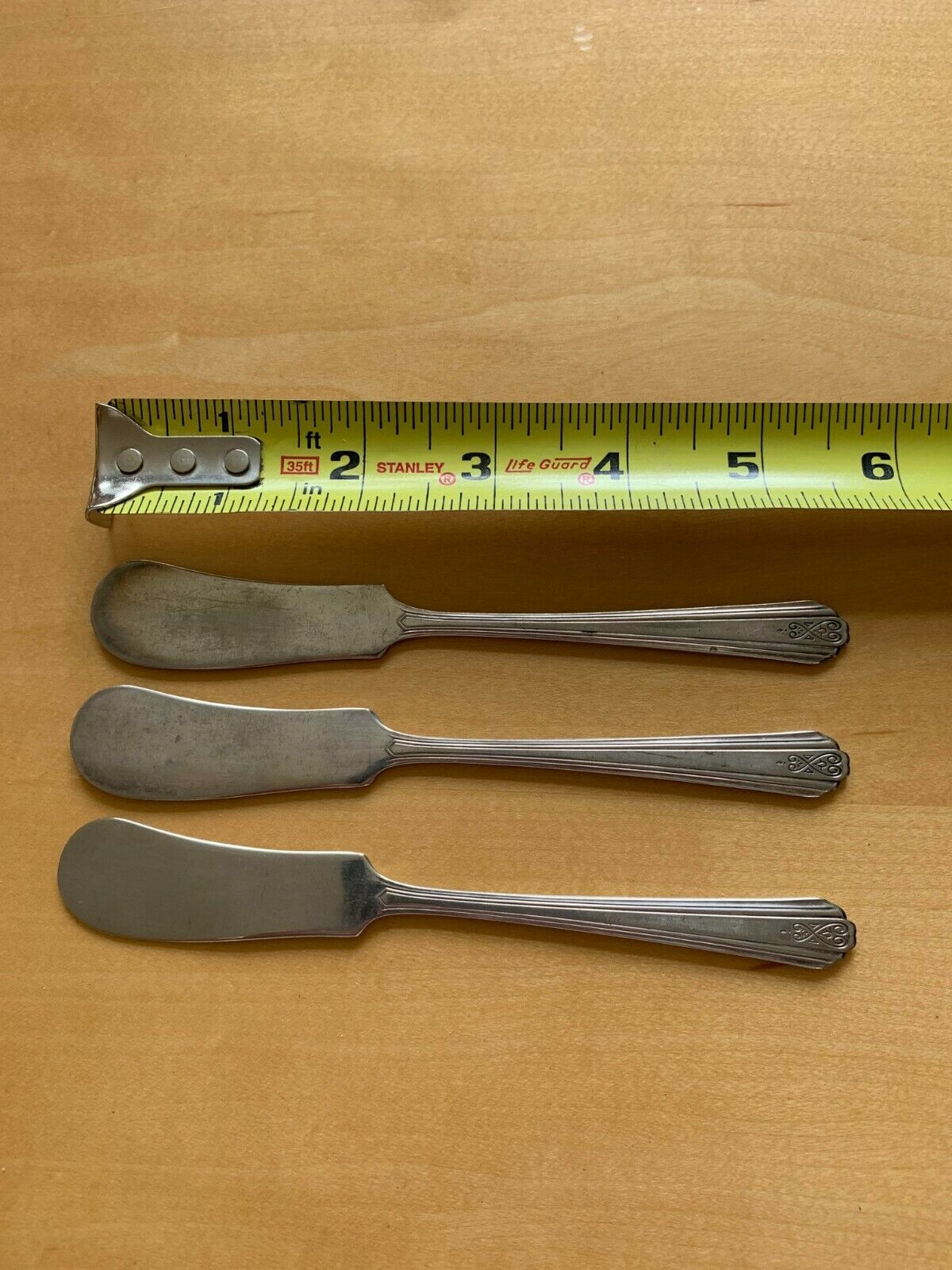 Antique Valuations: Moderne Silverplate Silver plate set of three butter spreaders, knife spreader