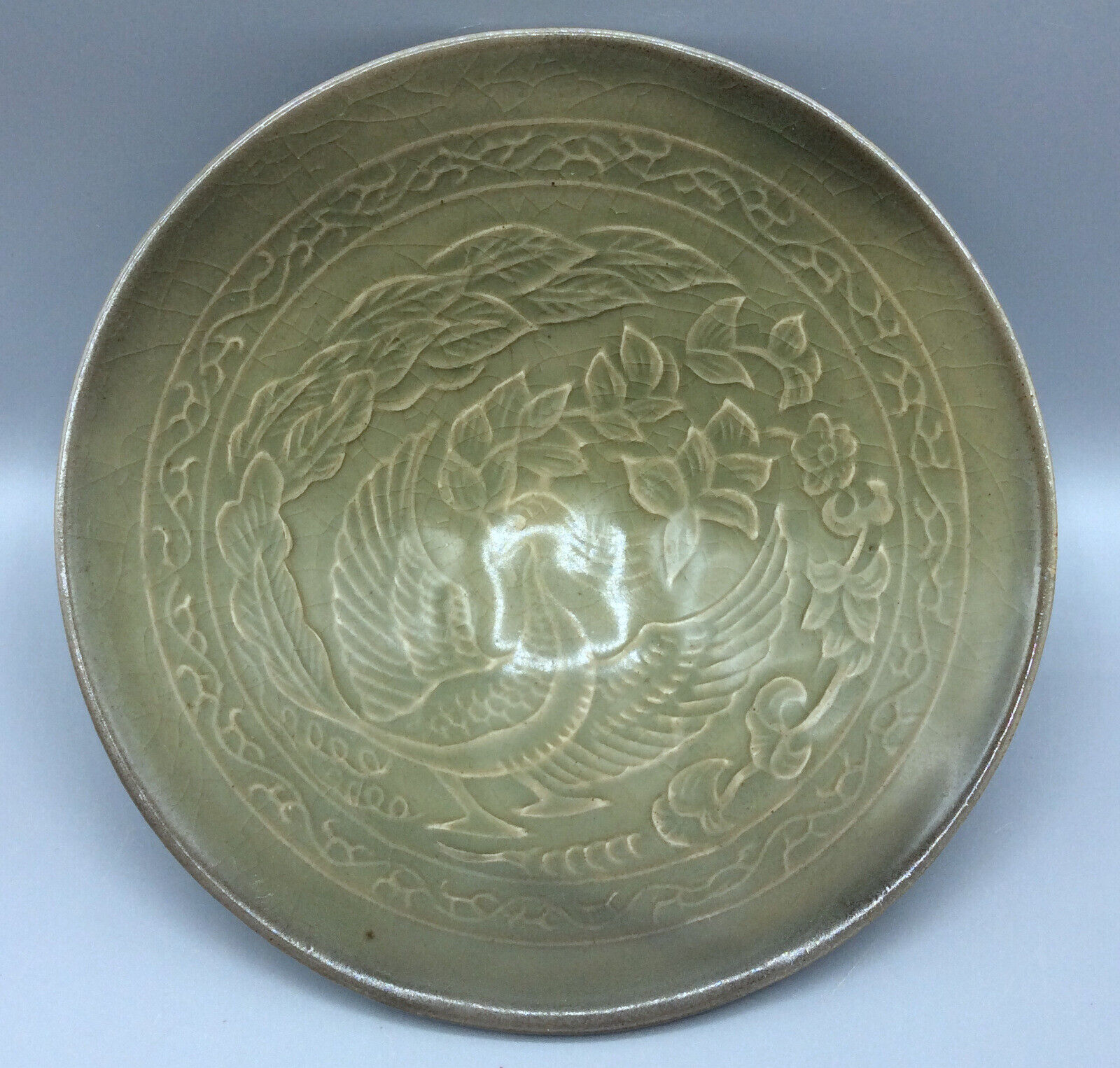 Antique Valuations: Antique Chinese Celadon Tea Bowl with phoenix and floral decoration