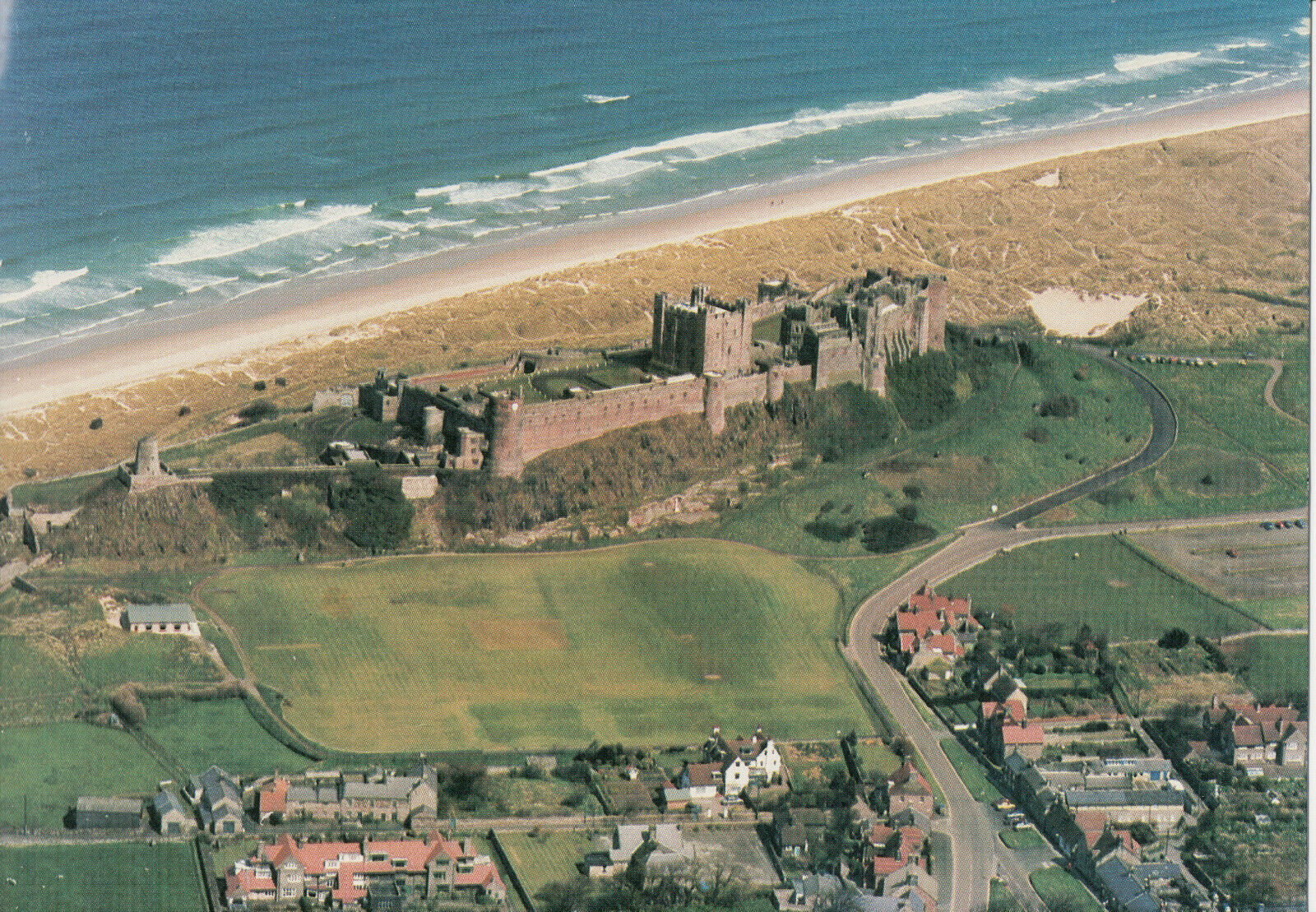 Service Aerial View of 12th C. Bamburgh Castle, Budle, Belford, Northumberland