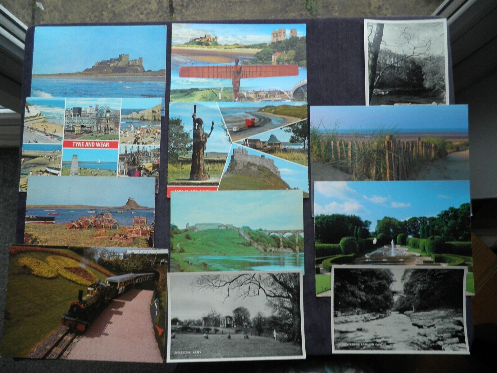 House Clearance - 12 POSTCARDS OF N. E. ENGLAND, ANGEL OF THE NORTH, HOLY ISLAND, BAMBURGH CASTLE